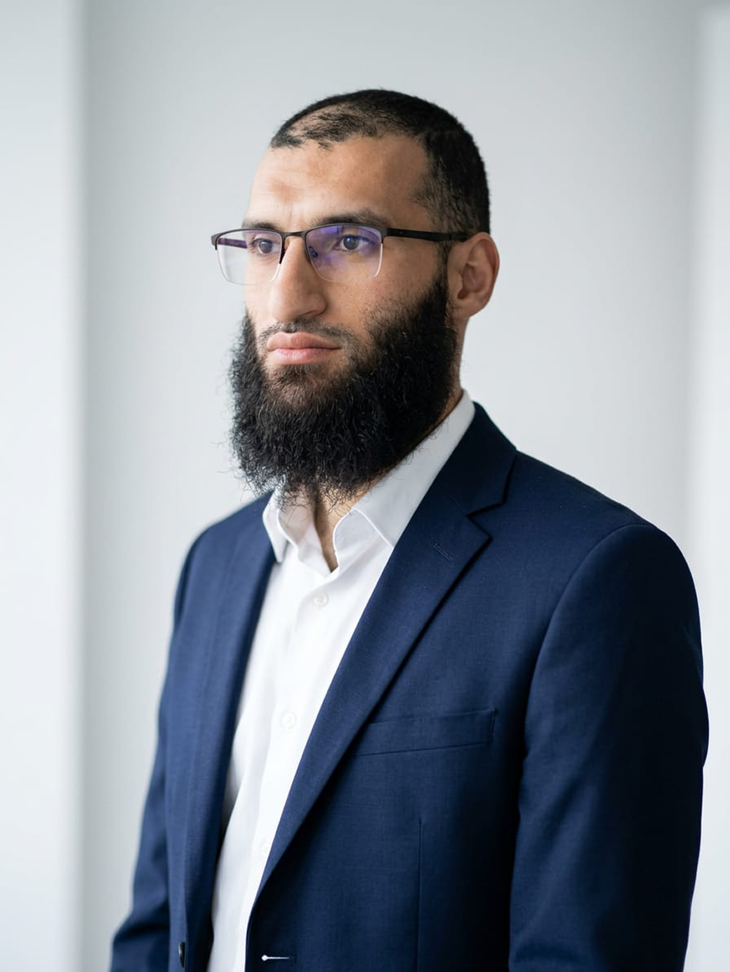 Professional portrait in a blue blazer and white shirt